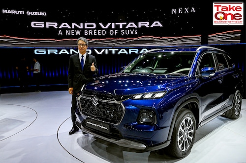 The managing director and chief executive officer of Maruti Suzuki India Limited (MSIL) Hisashi Takeuchi poses with the new  SUV Grand Vitara during its global unveiling ceremony in Gurgaon on July 20, 2022.
Image: Prakash Singh / AFP