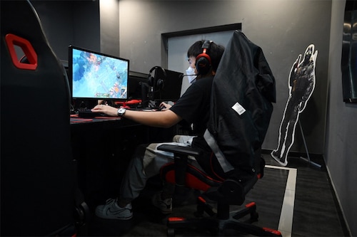 China has approved the release of dozens of new video games, sending the shares of some of its biggest tech firms soaring Wednesday.
Image: Greg Baker / AFP