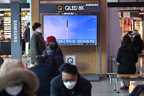 People watch a television screen showing a news broadcast with file footage of a North Korean missile test, at a railway station in Seoul on March 5, 2022, after North Korea fired at least one "unidentified projectile" in the country"s ninth suspected weapons test this year according to the South"s military.
Image: Jung Yeon-je / AFP via Getty Images People watch a television screen showing a news broadcast with file footage of a North Korean missile test, at a railway station in Seoul on March 5, 2022, after North Korea fired at least one "unidentified projectile" in the country"s ninth suspected weapons test this year according to the South"s military.
Image: Jung Yeon-je / AFP via Getty Images