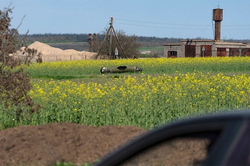 A photograph taken on April 30, 2022 shows the remain of a missile in the field on the outskirts of Berdyansk.â€‹ (Credit: Andrey BORODULIN / AFP)