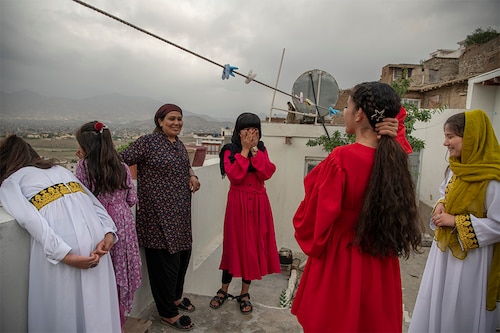 Girls and women at a home during the Eid al-Fitr holiday, in Kabul, Afghanistan, May 2, 2022. The ruling Taliban recently decreed that Afghan women must cover themselves from head to toe, and many girls have not been to school in months. Image: Kiana Hayeri/The New York Times