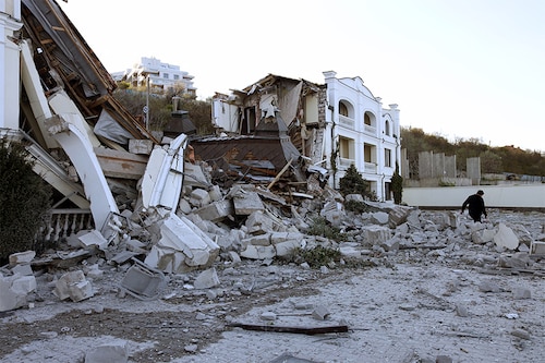 A man walks past beach hotel destroyed in Ukrainian city of Odessa on May 8, 2022, amid the Russian invasion of Ukraine.â€‹â€‹ (Credits: OLEKSANDR GIMANOV / AFP)
