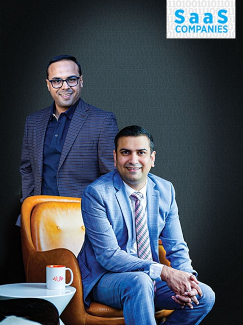 Umesh Sachdev (standing), co-founder &amp CEO Ravi Saraogi, co-founder &amp president APAC, Uniphore Solutions