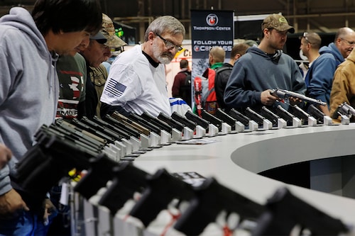 Visitors view gun displays at a National Rifle Association outdoor sports trade show on February 10, 2017 in Harrisburg, Pennsylvania. The Great American Outdoor Show, a nine day event celebrating hunting, fishing and outdoor traditions, features over 1,000 exhibitors ranging from shooting manufacturers to outfitters to fishing boats and RVs, and archery to art. Image: DOMINICK REUTER/AFP via Getty Images Visitors view gun displays at a National Rifle Association outdoor sports trade show on February 10, 2017 in Harrisburg, Pennsylvania. The Great American Outdoor Show, a nine day event celebrating hunting, fishing and outdoor traditions, features over 1,000 exhibitors ranging from shooting manufacturers to outfitters to fishing boats and RVs, and archery to art. Image: DOMINICK REUTER/AFP via Getty Images