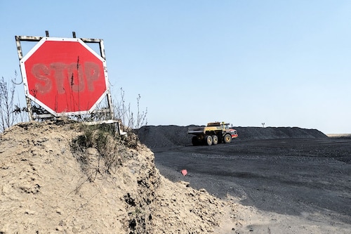 A truck is seen in the Grinding Station of Khutala Colliery in Mpumalanga, on September 29, 2022. An hour"s drive from Johannesburg, Khutala Colliery is among more than 100 coal mines and a dozen coal-fired plants that dot the industrial landscape of the northeastern province of Mpumalanga, an area known as South Africa"s coal belt. Photo: LUCA SOLA / AFP