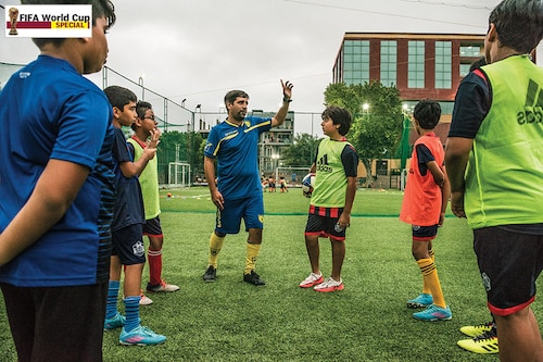 Davide Marchini (in blue jersey), a Uefa B licensed coach from Italy and technical director of Sports Roots, holds a session in Gurugram
Image: Amit Verma