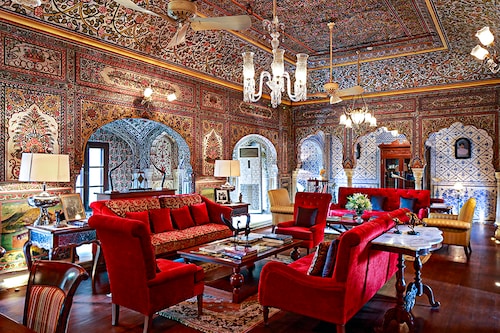 The magnificent living room of Samode Haveli, where the walls are adorned from floor to ceiling with hand-painted frescoes, dating back to the illustrious 18th century The magnificent living room of Samode Haveli, where the walls are adorned from floor to ceiling with hand-painted frescoes, dating back to the illustrious 18th century