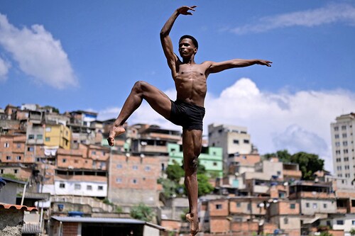 Brazilian dancer Dyhan Cardoso dances at the Aglomerado da Serra favela in Belo Horizonte, Brazil.
Image: Douglas Magno / AFP© Brazilian dancer Dyhan Cardoso dances at the Aglomerado da Serra favela in Belo Horizonte, Brazil.
Image: Douglas Magno / AFP©