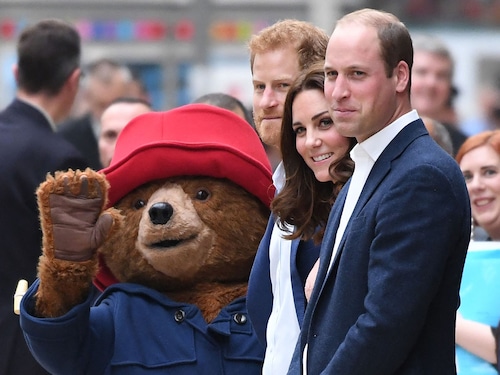 Britain"s Prince Harry (C), Britain"s Catherine, Duchess of Cambridge (2R) and Britain"s Prince William, Duke of Cambridge stand by a person in a Paddington Bear outfit in 2017 
Image: Chris J Ratcliffe / AFPÂ©