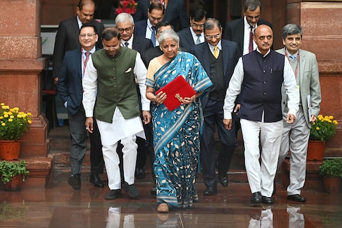 India"s Finance Minister Nirmala Sitharaman (C) holds the briefcase containing the annual budget documents as she leaves the Finance ministry with her staff to present the budget in the parliament in New Delhi on February 1, 2024.
Image: Sajjad Hussain / AFP India"s Finance Minister Nirmala Sitharaman (C) holds the briefcase containing the annual budget documents as she leaves the Finance ministry with her staff to present the budget in the parliament in New Delhi on February 1, 2024.
Image: Sajjad Hussain / AFP