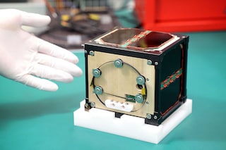The world"s first wooden satellite made from wood and named LignoSat, developed by scientists at Kyoto University and logging company Sumitomo Forestry, is shown during a press conference at Kyoto University in Kyoto.
Image: STR / JIJI Press / AFPÂ©
