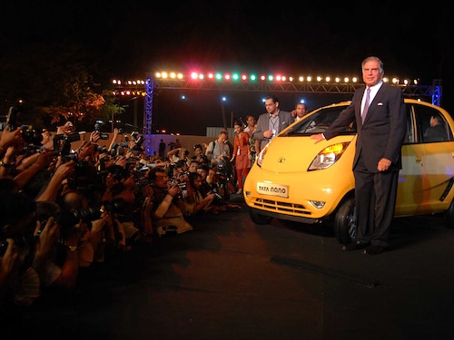 Ratan Tata, Chairman of Tata Motors and Tata Sons with Ravi Kanth, Managing Director of Tata Motors, posing with newly launched Tata Nano in Mumbai. 
Image: Abhijit Bhatlekar/Mint via Getty Images