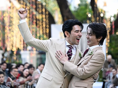 This photo taken on January 10, 2025 shows Apiwat "Porsch" Apiwatsayree (L) and Sappanyoo "Arm" Panatkool posing for photos at their unofficial wedding ceremony in Bangkok.
Image: Lillian Suwanrumpha / AFP© This photo taken on January 10, 2025 shows Apiwat "Porsch" Apiwatsayree (L) and Sappanyoo "Arm" Panatkool posing for photos at their unofficial wedding ceremony in Bangkok.
Image: Lillian Suwanrumpha / AFP©
