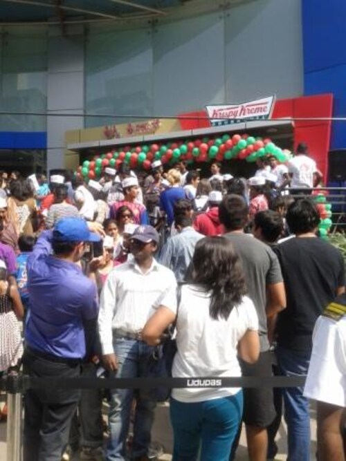People with a sweet tooth lined up the previous day to be the first customer at Krispy Kreme