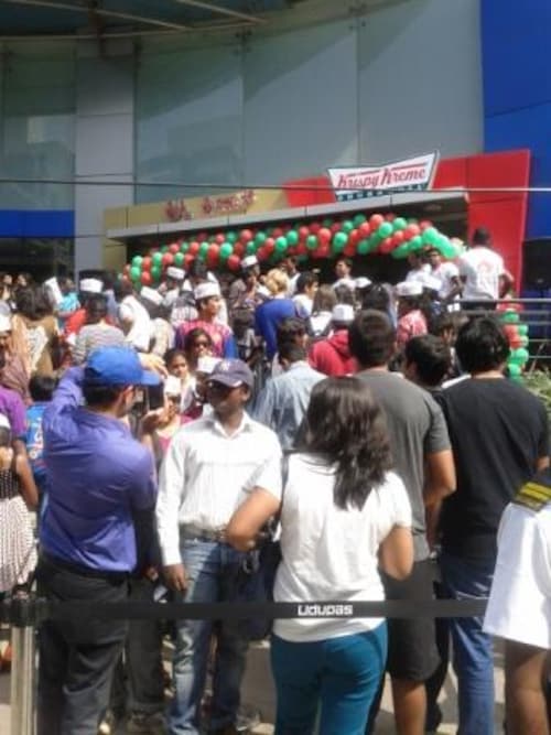 People with a sweet tooth lined up the previous day to be the first customer at Krispy Kreme People with a sweet tooth lined up the previous day to be the first customer at Krispy Kreme