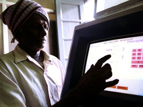 An Indian farmer uses a computer to check land-records in the village of Ramanagaram 40 km (25 miles) in the southern Indian state of Karnataka, May 26, 2001. The southern state is championing the process to rebut criticism that its software boom is only for the rich, now plans to guide the rest of India in a plan, which is aimed at fighting corruption and boosting transparency.
JSG/CC - RTRIZ6U An Indian farmer uses a computer to check land-records in the village of Ramanagaram 40 km (25 miles) in the southern Indian state of Karnataka, May 26, 2001. The southern state is championing the process to rebut criticism that its software boom is only for the rich, now plans to guide the rest of India in a plan, which is aimed at fighting corruption and boosting transparency.
JSG/CC - RTRIZ6U