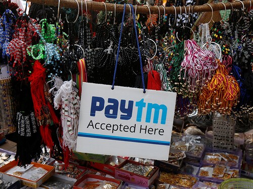An advertisement of Paytm, a digital wallet company, is pictured at a road side stall in Kolkata, India, January 25, 2017. Picture taken January 25, 2017. REUTERS/Rupak De Chowdhuri - RTX30SOV