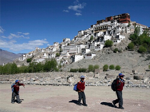 Schoolchildren walk to their school near the Thiksey monastery, 20 km (12 miles) east of Leh, May 14, 2009. Leh is the main town of Ladakh, a mountain desert which forms a part of troubled Jammu and Kashmir state and borders both China and Pakistan. The people of this region are predominantly Buddhist. REUTERS/Amit Gupta (INDIAN-ADMINISTERED KASHMIR SOCIETY TRAVEL RELIGION) - RTXGNS4 Schoolchildren walk to their school near the Thiksey monastery, 20 km (12 miles) east of Leh, May 14, 2009. Leh is the main town of Ladakh, a mountain desert which forms a part of troubled Jammu and Kashmir state and borders both China and Pakistan. The people of this region are predominantly Buddhist. REUTERS/Amit Gupta (INDIAN-ADMINISTERED KASHMIR SOCIETY TRAVEL RELIGION) - RTXGNS4