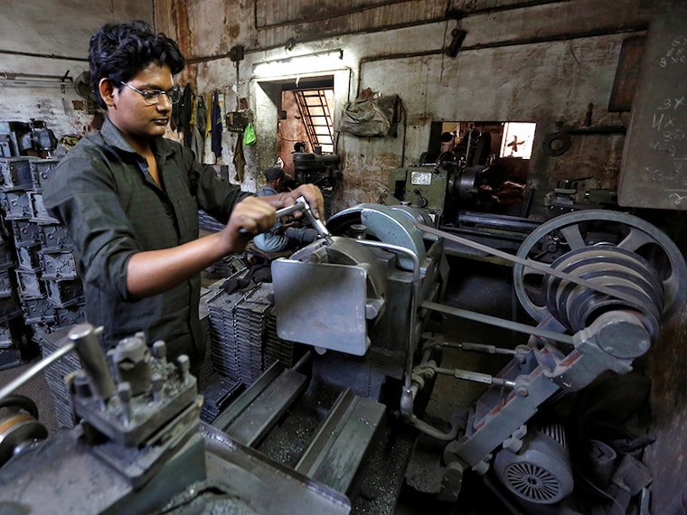 A worker operates a lathe inside a small scale manufacturing unit in Ahmedabad, India, April 12, 2016. India's industrial output grew at an annual rate of 2.0 percent in February, government data showed on Tuesday. REUTERS/Amit Dave - D1AESXYHZXAB