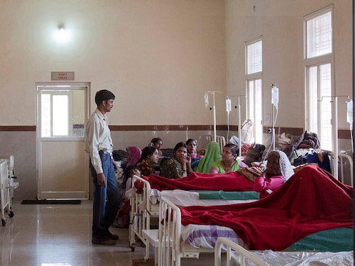 Women who have recently given birth and their relatives are pictured through a nurse's observaton window as they rest in a post delivery ward at a district hospital in Shivpuri, in the central Indian state of Madhya Pradesh, February 25, 2012. In rural Madhya Pradesh, an innovative free maternity ambulance service called "Janani Express", which runs in partnership between the state government and the United Nations Children's Fund (UNICEF), is trying to increase the number of babies born in clinics where proper care can be provided to the mothers and newborn children, and infant mortality can be decreased. Before this initiative, women would have been left to give birth in the fields or on mud floors. Now, the free ambulance brings pregnant women across dusty roads to health clinics where they can give birth safely under basic medical supervision, be nursed afterwards and educated on the importance of breastfeeding and hygiene before returning to their villages and communities. The United Nations' International Women's Day will be celebrated on March 8. Picture taken February 25, 2012. REUTERS/Vivek Prakash (INDIA - Tags: HEALTH SOCIETY POVERTY) - GM1E83617HV01 Women who have recently given birth and their relatives are pictured through a nurse's observaton window as they rest in a post delivery ward at a district hospital in Shivpuri, in the central Indian state of Madhya Pradesh, February 25, 2012. In rural Madhya Pradesh, an innovative free maternity ambulance service called "Janani Express", which runs in partnership between the state government and the United Nations Children's Fund (UNICEF), is trying to increase the number of babies born in clinics where proper care can be provided to the mothers and newborn children, and infant mortality can be decreased. Before this initiative, women would have been left to give birth in the fields or on mud floors. Now, the free ambulance brings pregnant women across dusty roads to health clinics where they can give birth safely under basic medical supervision, be nursed afterwards and educated on the importance of breastfeeding and hygiene before returning to their villages and communities. The United Nations' International Women's Day will be celebrated on March 8. Picture taken February 25, 2012. REUTERS/Vivek Prakash (INDIA - Tags: HEALTH SOCIETY POVERTY) - GM1E83617HV01