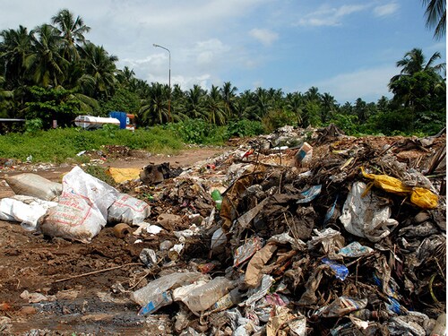 INDIA - OCTOBER 29:  View of Garbage at Kovalam Beach, Kerala, India ( Beach, Boat, Tourist, Plants, Backwater, Workers, Fisherman Lake Resort )  (Photo by Mandar Deodhar/The India Today Group/Getty Images)