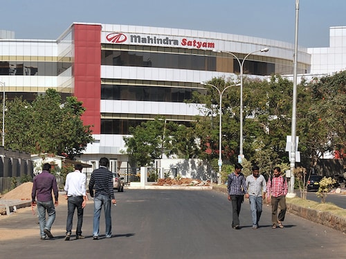 Employees walk in front of the Mahindra Satyam building at HITECH City (Hyderabad Information Technology Engineering Consultancy), or Cyberabad, a major technology township at the centre of the information technology industry in Hyderabad on March 3, 2012. HITECH City, has become one of India’s premiere information technology and IT-enabled service hubs and has become the country’s centre for scientific and technological development not only in IT infrastructure but also in pharmaceutical and science research industries. Cyderabad is the financial and technological capital of the state of Andhra Pradesh. AFP PHOTO / Noah SEELAM (Photo credit should read NOAH SEELAM/AFP/Getty Images) Employees walk in front of the Mahindra Satyam building at HITECH City (Hyderabad Information Technology Engineering Consultancy), or Cyberabad, a major technology township at the centre of the information technology industry in Hyderabad on March 3, 2012. HITECH City, has become one of India’s premiere information technology and IT-enabled service hubs and has become the country’s centre for scientific and technological development not only in IT infrastructure but also in pharmaceutical and science research industries. Cyderabad is the financial and technological capital of the state of Andhra Pradesh. AFP PHOTO / Noah SEELAM (Photo credit should read NOAH SEELAM/AFP/Getty Images)