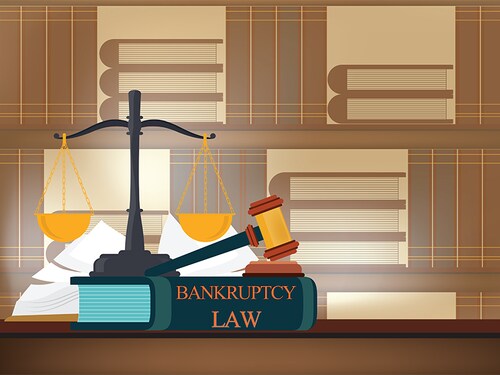 Bankruptcy  law books on a table and blurred bookshelves background with a judge's gavel , judicial and law system conceptual vector illustration.