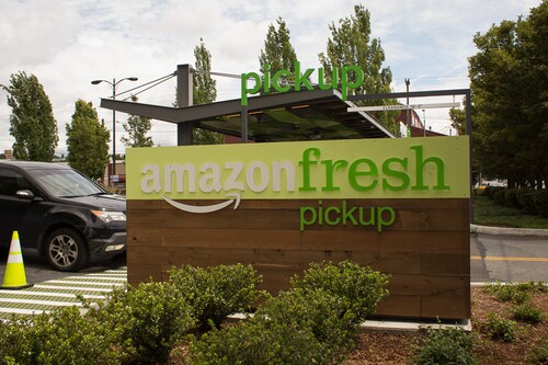 SEATTLE, WA - JUNE 16: A car drives past an AmazonFresh Pickup location on June 16, 2017 in Seattle, Washington. Amazon announced that it will buy Whole Foods Market, Inc. for over $13 billion dollars.  (Photo by David Ryder/Getty Images)