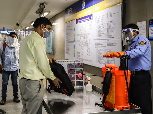 NEW DELHI, INDIA - SEPTEMBER 07: Passengers are being disinfected before taking Delhi metro, on the first day of the restart of their operations, over five months suspension due to COVID-19 outbreak in New Delhi on September 7, 2020. (Photo by Amarjeet Kumar Singh/Anadolu Agency via Getty Images)