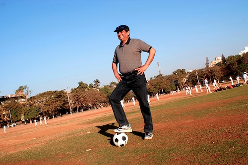 Aditya Puri, Managing Director, HDFC Bank poses with Football, at a Playground in Mumbai, India; Image: Umesh Goswami/The The India Today Group via Getty Images