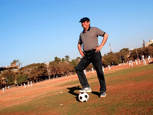 INDIA - FEBRUARY 01:  Aditya Puri, Managing Director, HDFC Bank poses with Football, at a Playground in Mumbai, India. Profile  (Photo by Umesh Goswami/The The India Today Group via Getty Images)