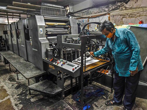 NEW DELHI, INDIA - JUNE 10:  A man working on an offset printer at a printing unit  at Okhla industrial area on June 10, 2020 in New Delhi, India. And even when several sectors are now being gradually re-opened by easing strict restrictions, the migration migraine continues, leaving Delhi-NCR reeling under a huge shortage of workforce. The labour crisis has affected the region's Micro, Small &amp; Medium Enterprises (MSMEs) the most. Many owners have not been able to resume work despite permission for staggered operations given in the May 18 lockdown 3.0 guidelines. (Photo by Biplov Bhuyan/Hindustan Times via Getty Images)