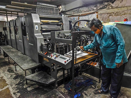 NEW DELHI, INDIA - JUNE 10: A man working on an offset printer at a printing unit at Okhla industrial area on June 10, 2020 in New Delhi, India. And even when several sectors are now being gradually re-opened by easing strict restrictions, the migration migraine continues, leaving Delhi-NCR reeling under a huge shortage of workforce. The labour crisis has affected the region's Micro, Small & Medium Enterprises (MSMEs) the most. Many owners have not been able to resume work despite permission for staggered operations given in the May 18 lockdown 3.0 guidelines. (Photo by Biplov Bhuyan/Hindustan Times via Getty Images) NEW DELHI, INDIA - JUNE 10: A man working on an offset printer at a printing unit at Okhla industrial area on June 10, 2020 in New Delhi, India. And even when several sectors are now being gradually re-opened by easing strict restrictions, the migration migraine continues, leaving Delhi-NCR reeling under a huge shortage of workforce. The labour crisis has affected the region's Micro, Small & Medium Enterprises (MSMEs) the most. Many owners have not been able to resume work despite permission for staggered operations given in the May 18 lockdown 3.0 guidelines. (Photo by Biplov Bhuyan/Hindustan Times via Getty Images)