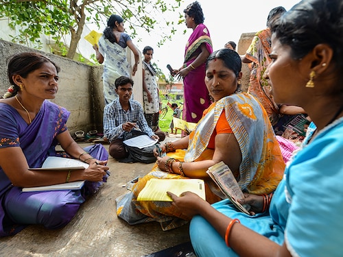BANGALORE, INDIA - JUNE 3: Member of a Microfinance Institution (MFI) at a monthly meeting held at one of the customers house, which is one of the meeting point to collect the monthly Equated Monthly Installment (EMI) on June 3, 2015 in Bangalore, India. (Photo by Hemant Mishra/Mint via Getty Images)
