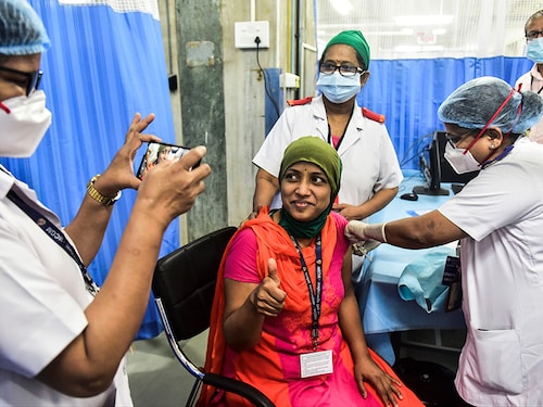 MUMBAI, INDIA - JANUARY 16: BMC medical staffer Pragati Dalvi, poses for a photo while receiving a Covid-19 vaccine shot at KEM hospital, on January 16, 2021 in Mumbai, India. (Photo by Anshuman Poyrekar/Hindustan Times via Getty Images)