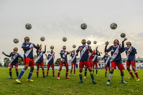 Indian girls players of the Youth Football Club (YFC) practice at Rurka Kalan village, some 40 km from Jalandhar on June 9, 2018; Image: Shammi Mehra/AFP