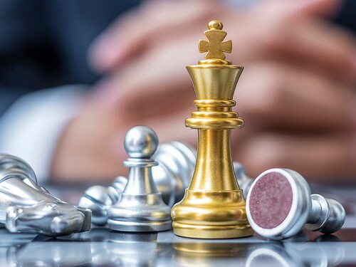 gold Chess King figure stand out from crowd of enermy or opponent during chessboard competition. Strategy, Success, management, business planning, interruption, win and leadership concept