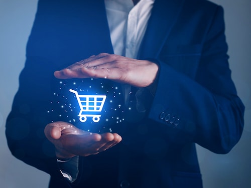 Businessman pointing on virtual e-shop button. Online shopping concept,  e-commerce and B2C.