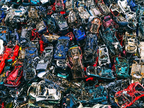 Scrapped cars stacked on a scrap yard. Car recycling