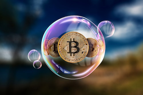 Gold Coins Bitcoin in a soap bubble. The concept of instability of the crypto currency, electronic money, the burning of the crypto currency.