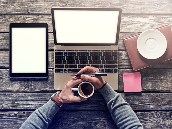 Top view mockup - laptop and tablet pc with cup of coffee. Clipping paths included.