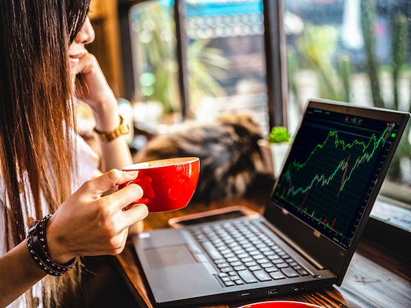 Intraday stock trader businesswoman working at coffee shop bar for business cafe hopper lifestyle.