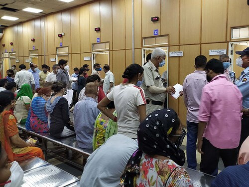 NEW DELHI, INDIA - JUNE 18: People seen flouting social distancing norms at the super speciality OPD centre at Ram Manohar Lohia (RML) hospital, on June 18, 2021 in New Delhi, India. (Photo by Arvind Yadav/Hindustan Times via Getty Images)