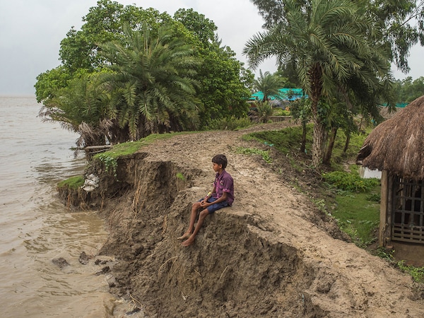 On 28 August 2017 in Ghoramara, India. The villagers don't have any permanent home and they have to shift their base anytime when required for their safety. Ghoramara is an island located in the South 24- Parganas , 150kms south of Kolkata, India on the South Delta Complex of the Bay of Bengal. It is one of the 54 islands of the Sundarbans deltaic region which is withering away extensively than predicted. The continual rise in sea level due to Global warming is a major threat to the low-lying islands like Ghoramara. Over the last few decades, the island has lost almost 75% of its land and is now left with 3.3 Sq. Km area. The frequent cyclones and tidal floods in this region everyday swallow bits and pieces of this island and soon to be completely gulped by the outrageous sea. (Photo by Sushavan Nandy/NurPhoto via Getty Images)