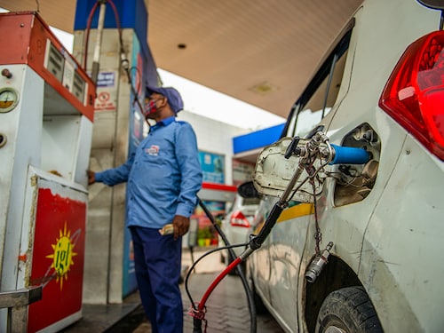 New Delhi, India- June 11 2021: An employee Handle CNG Gas dispenser for refuel CNG Vehicle fueling facility at CNG pump station in New Delhi,