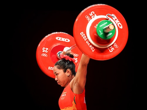 TOKYO, JAPAN - JULY 24: Chanu Saikhom Mirabai of Team India competes during the Weightlifting - Women's 49kg Group A on day one of the Tokyo 2020 Olympic Games at Tokyo International Forum on July 24, 2021 in Tokyo, Japan. (Photo by Chris Graythen/Getty Images)