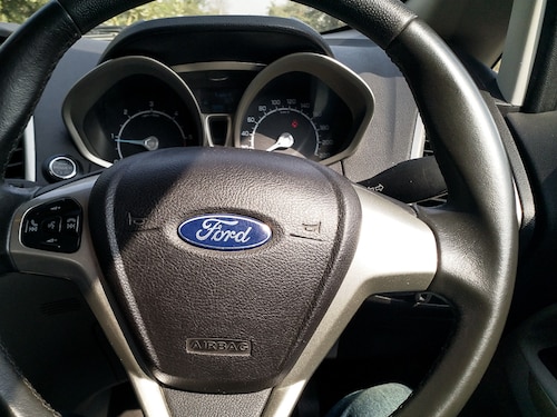 Udaipur, India - February 24 2020: Steering Wheel of Ford Ecosport having Media Controls | Instrument Cluster | Push Start Button