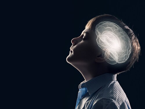 Young thoughtful boy of school age with closed eyes