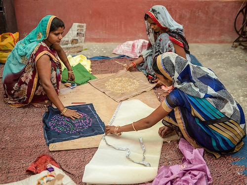 Varanasi / India 24 April 2019 Indian rural village self employed women makes a cushion cover from recycled materials at a workshop in Varanasi area northern Indian state of Uttar Pradesh
