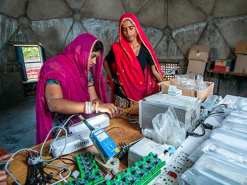 Tilonia, Rajasthan, India, 6 September 2011: Rural women from Barefoot college of Rajasthan making electric circuit to bring electricity from solar energy to her village .